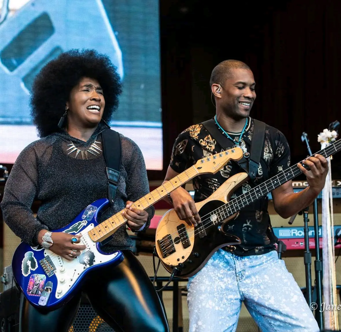 Jeremiah Hunt performing bass alongside a vocalist on stage